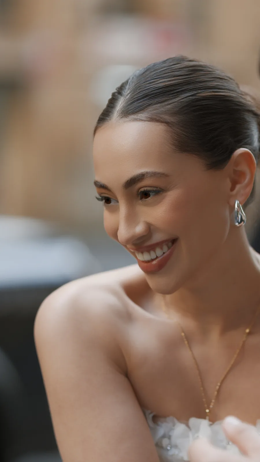 Bride portrait smiling with earrings and feather gown – Japanese documentary wedding photographer Sydney