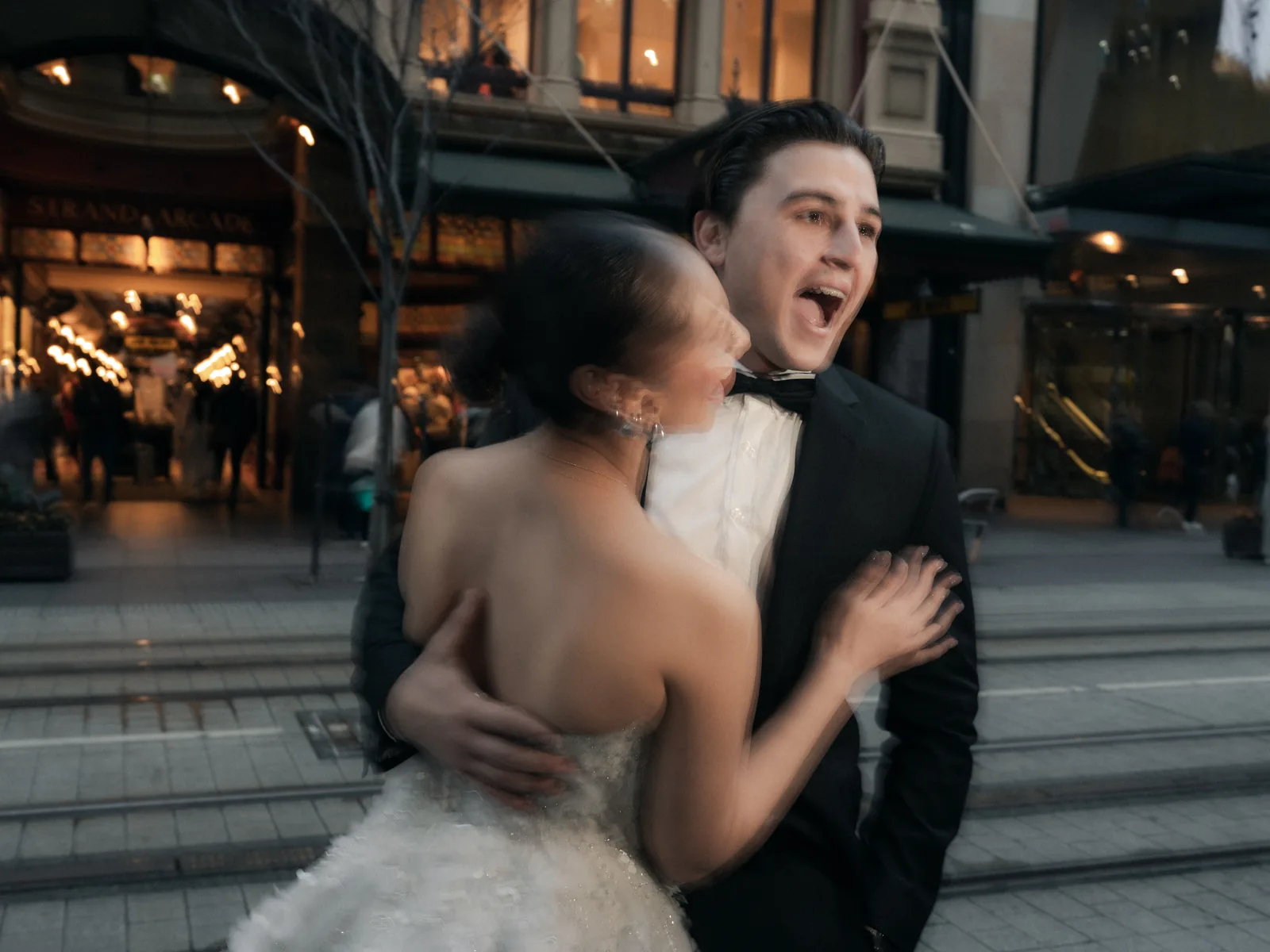 Couple laughing in Sydney CBD city street – Japanese documentary wedding photographer Sydney