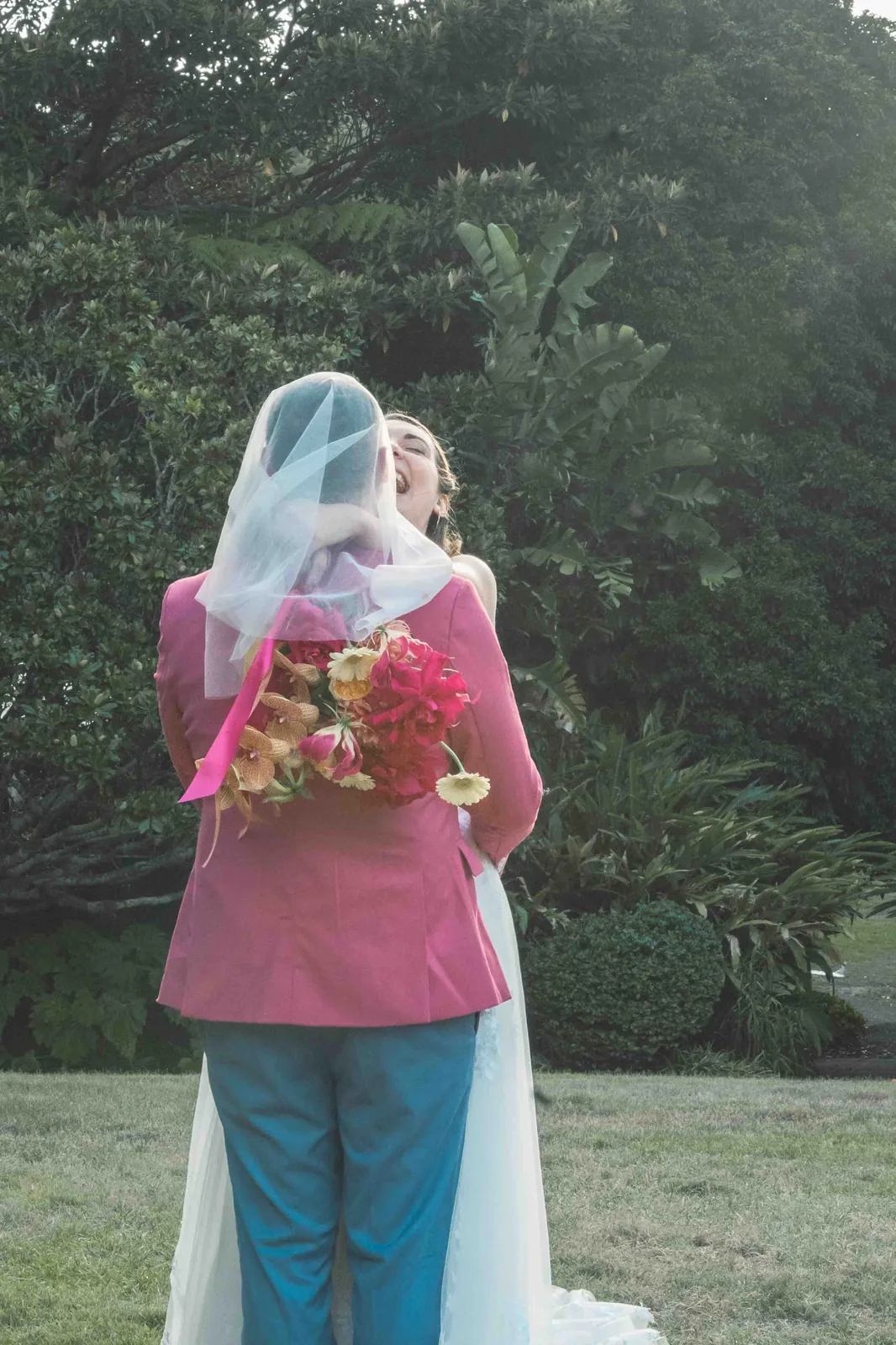 Couple embracing under veil at Vaucluse House garden – Japanese documentary wedding photographer Sydney