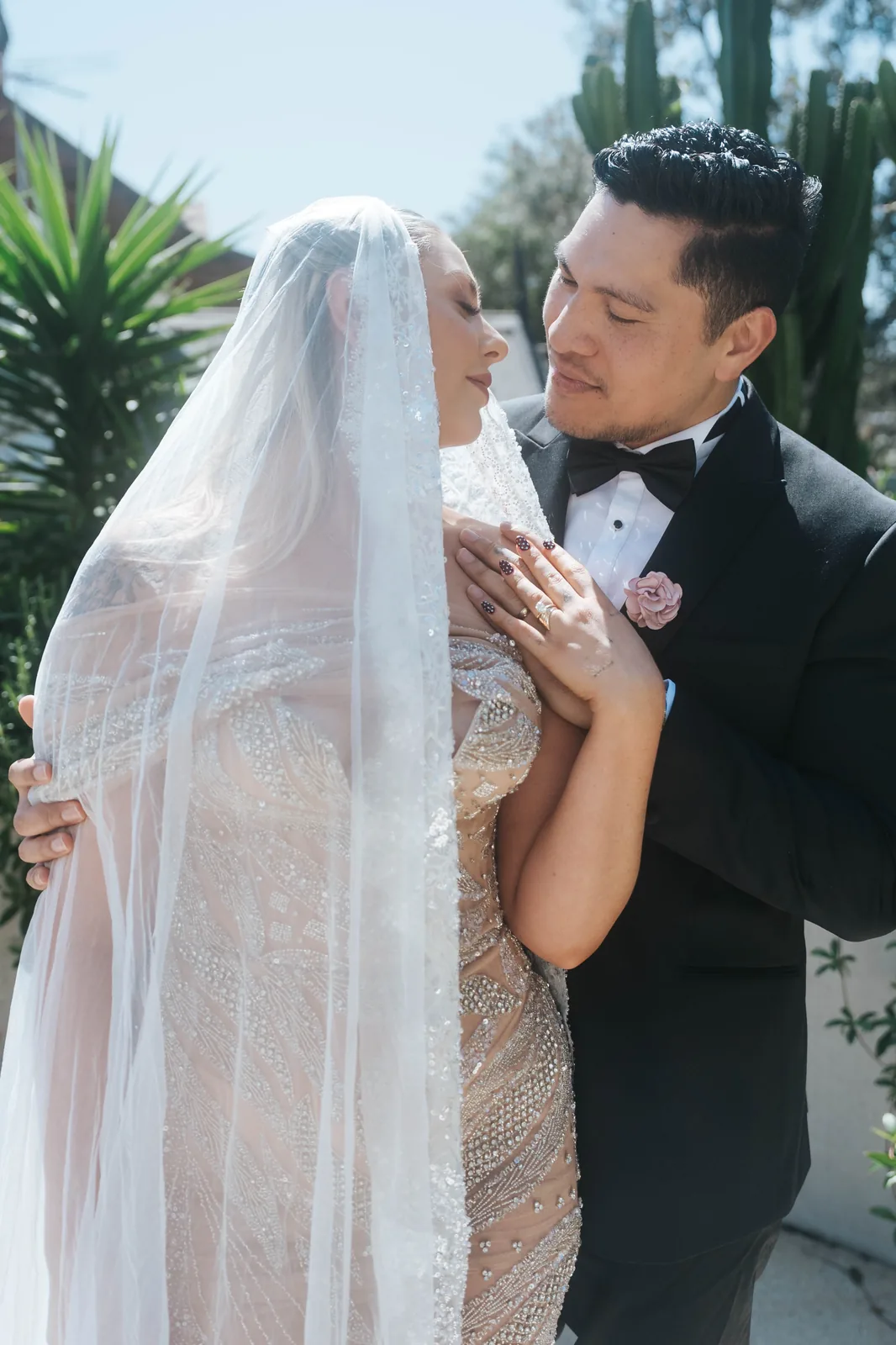 Bride and groom veil embrace – Sydney documentary wedding photographer